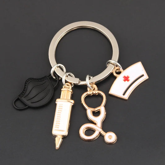 A cute nurse‑themed stethoscope keyring featuring a medical mask and syringe charm, perfect for bags, purses, and everyday accessories.